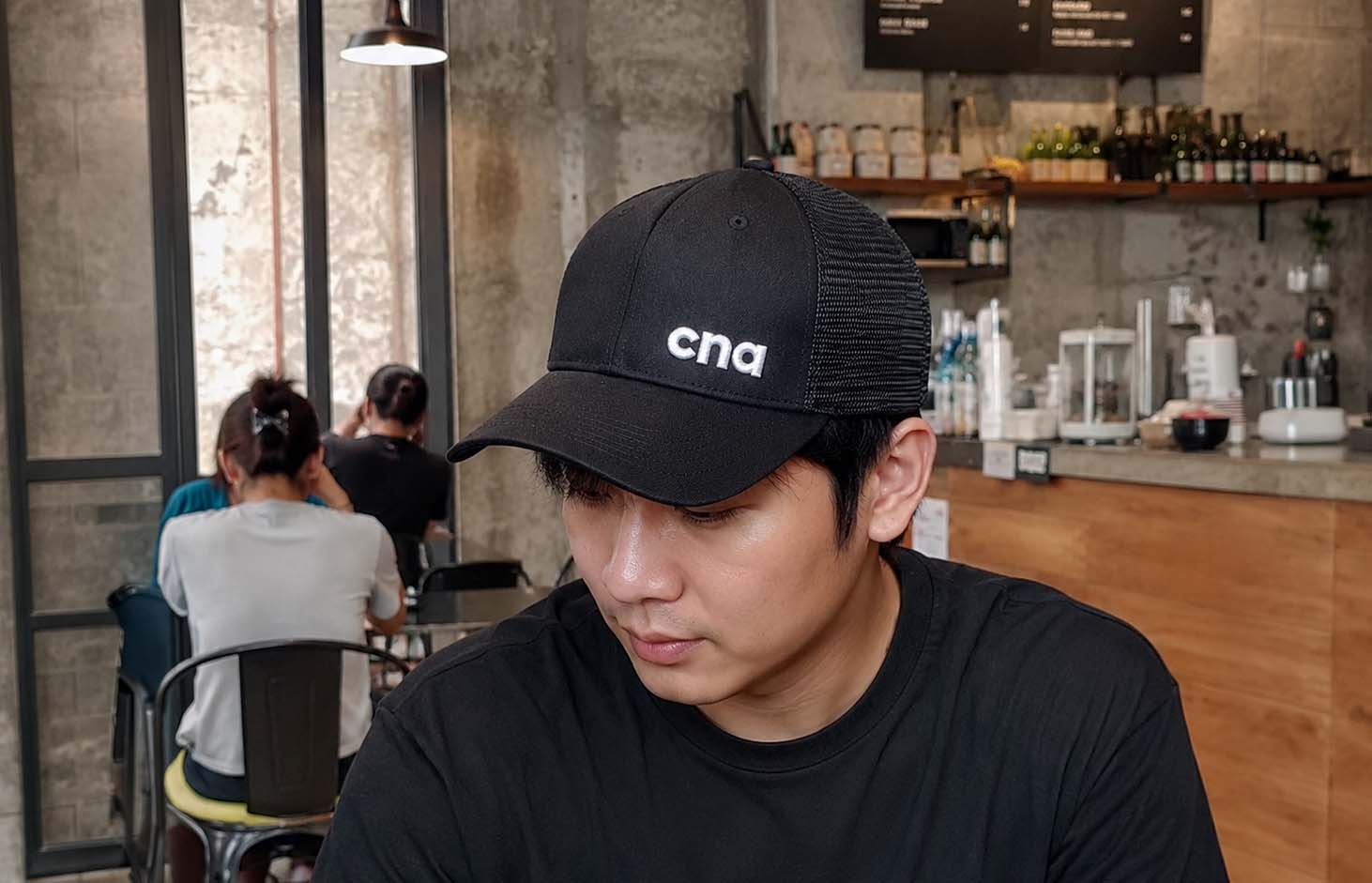 College of the North Atlantic cap worn in a cafe