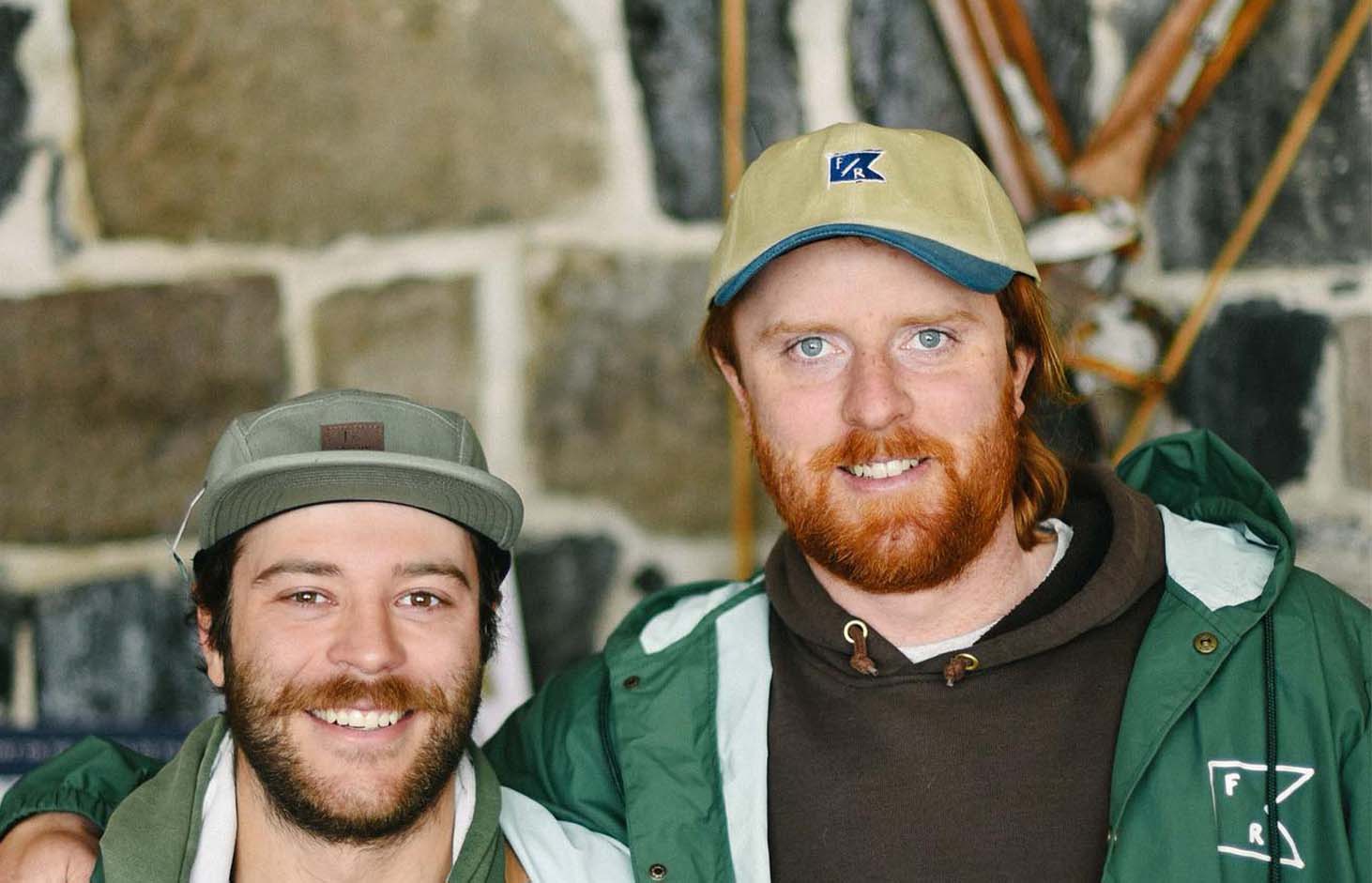 Falcon Ridge caps worn by two people