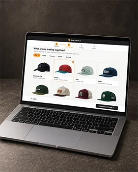 Laptop showing the Browse Product page with headwear styles